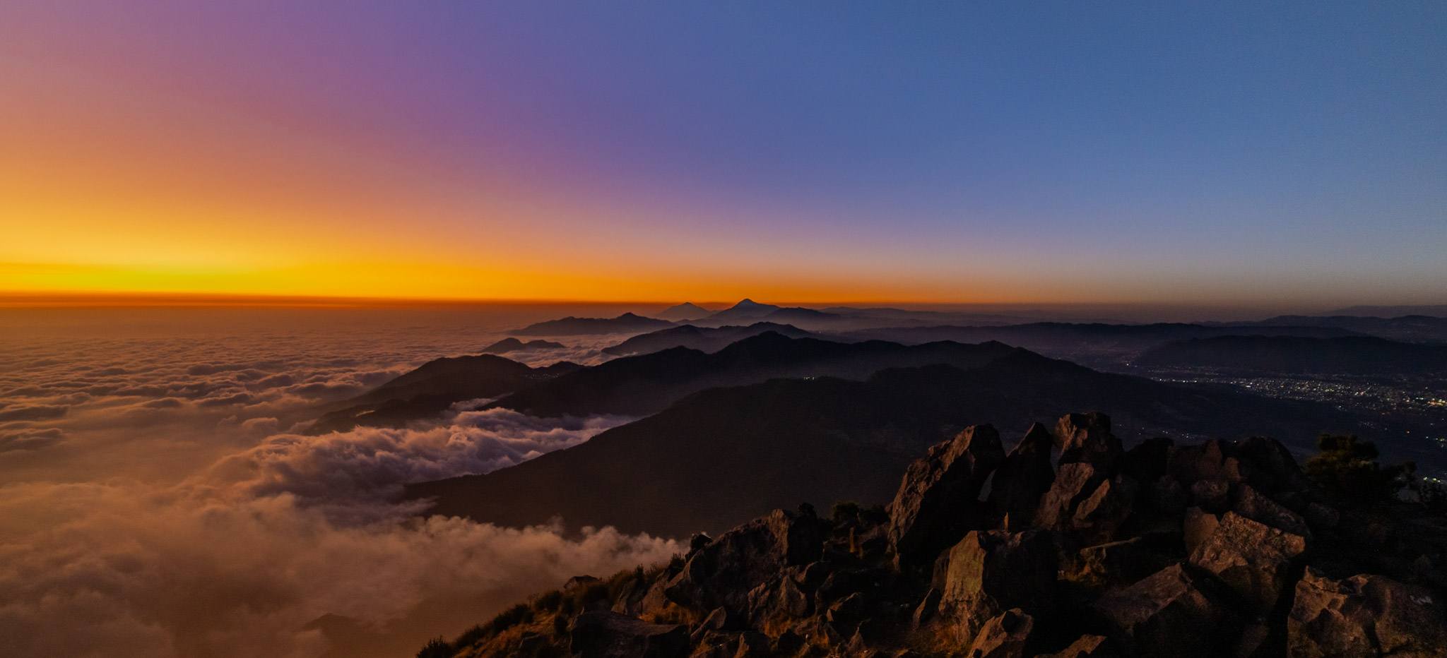 A sunset view from Santa María reaching all the way to Volcán Tacaná on the Mexican border.