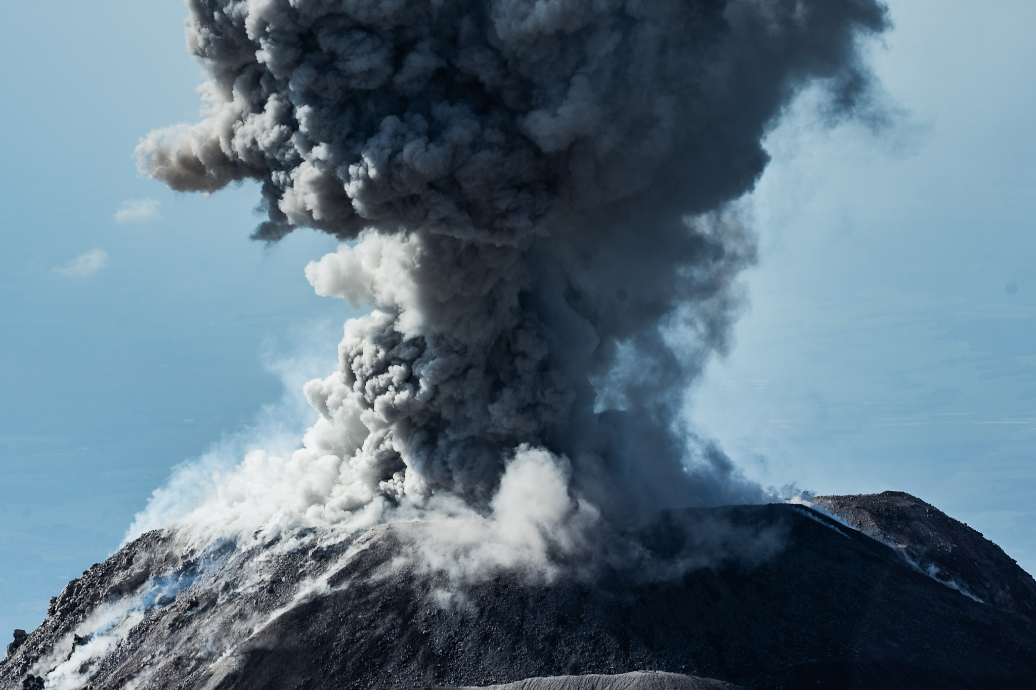 Daytime volcanic explosion seen from the mirador